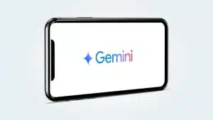 Teléfono móvil con Gemini, la inteligencia artificial de Google, de fondo de pantalla